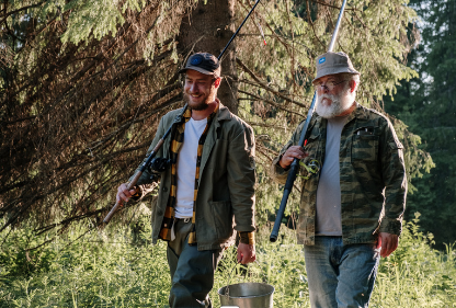 Two friends coming back from a fishing trip